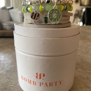 Bomb Party Kiwi stacks bracelets.  3 bracelets, 2 are stretchy.